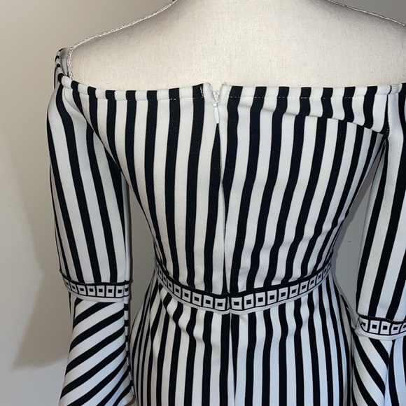 Black and white spandex dress. Shows curves - Picture 3 of 5